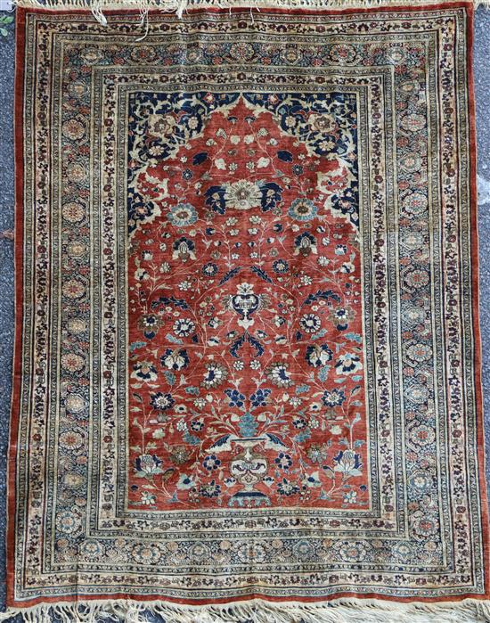 A Tabriz silk rug, 5ft 9in by 4ft 6in.